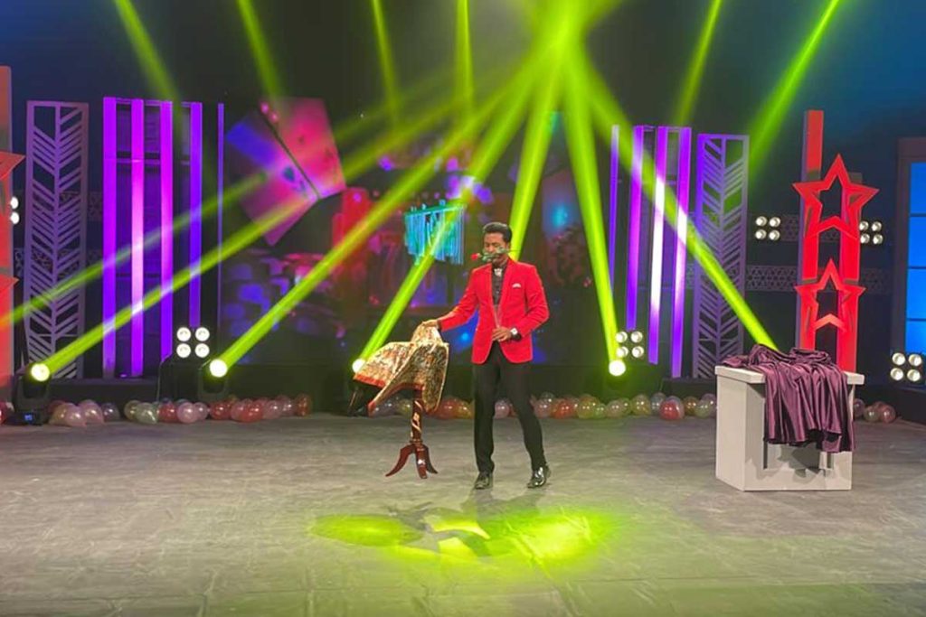 Prince Harun performing a live television magic show in Bangladesh