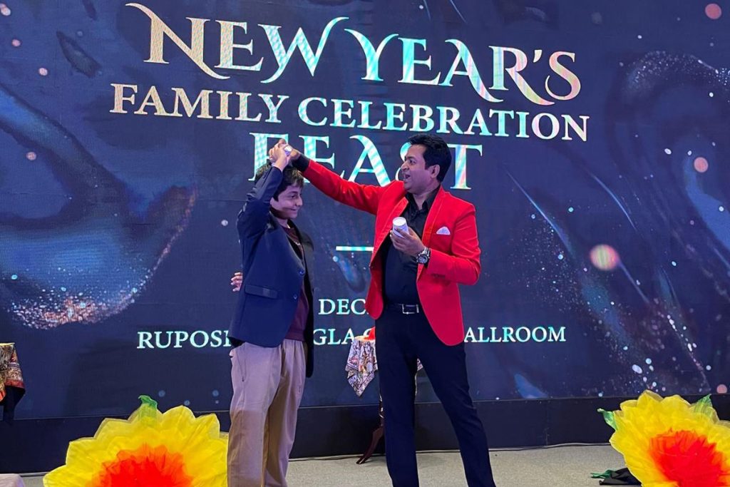 Prince Harun performing a stage magic show in Bangladesh