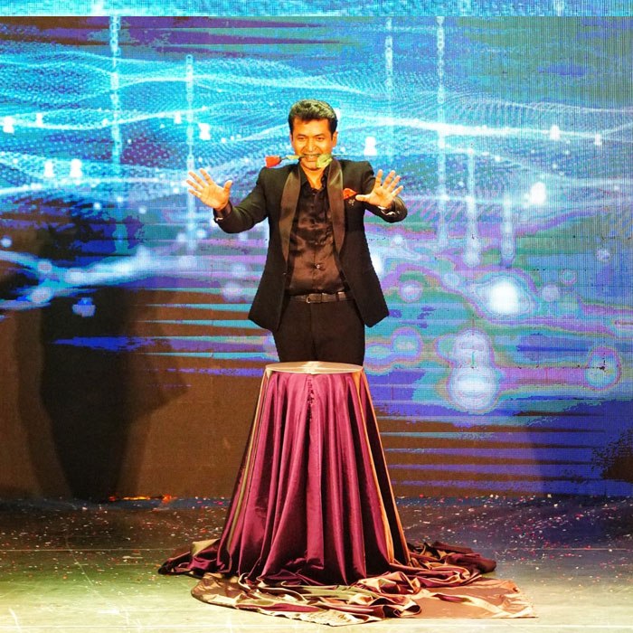 Prince Harun performing solo magic show on stage