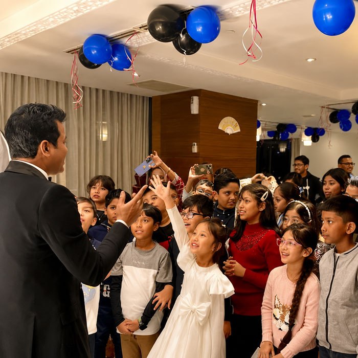 Prince Harun entertaining audiences with parlor magic