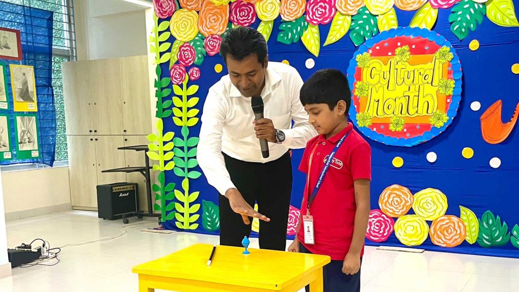 Prince Harun teaching magic to students in Bangladesh